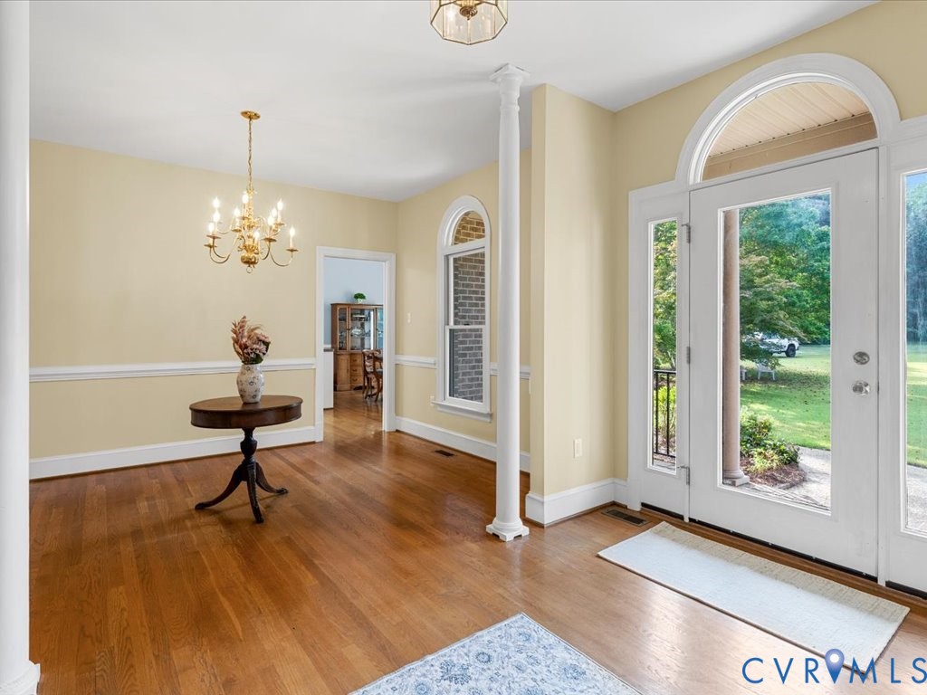 5515 Herring Creek Road Aylett, VA 23009 - Photo 13 of 50 a living room with furniture and a chandelier