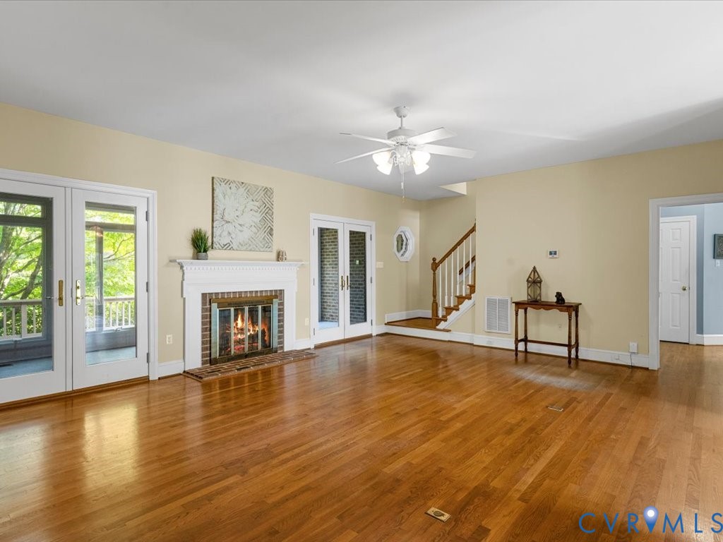5515 Herring Creek Road Aylett, VA 23009 - Photo 18 of 50 a view of empty room with wooden floor and fireplace