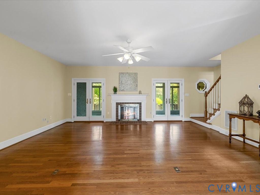 5515 Herring Creek Road Aylett, VA 23009 - Photo 19 of 50 a view of an empty room with window and wooden floor