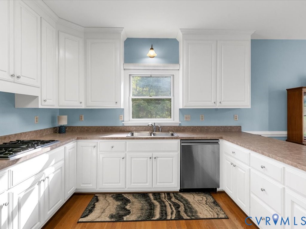 5515 Herring Creek Road Aylett, VA 23009 - Photo 24 of 50 a kitchen with granite countertop white cabinets and white appliances
