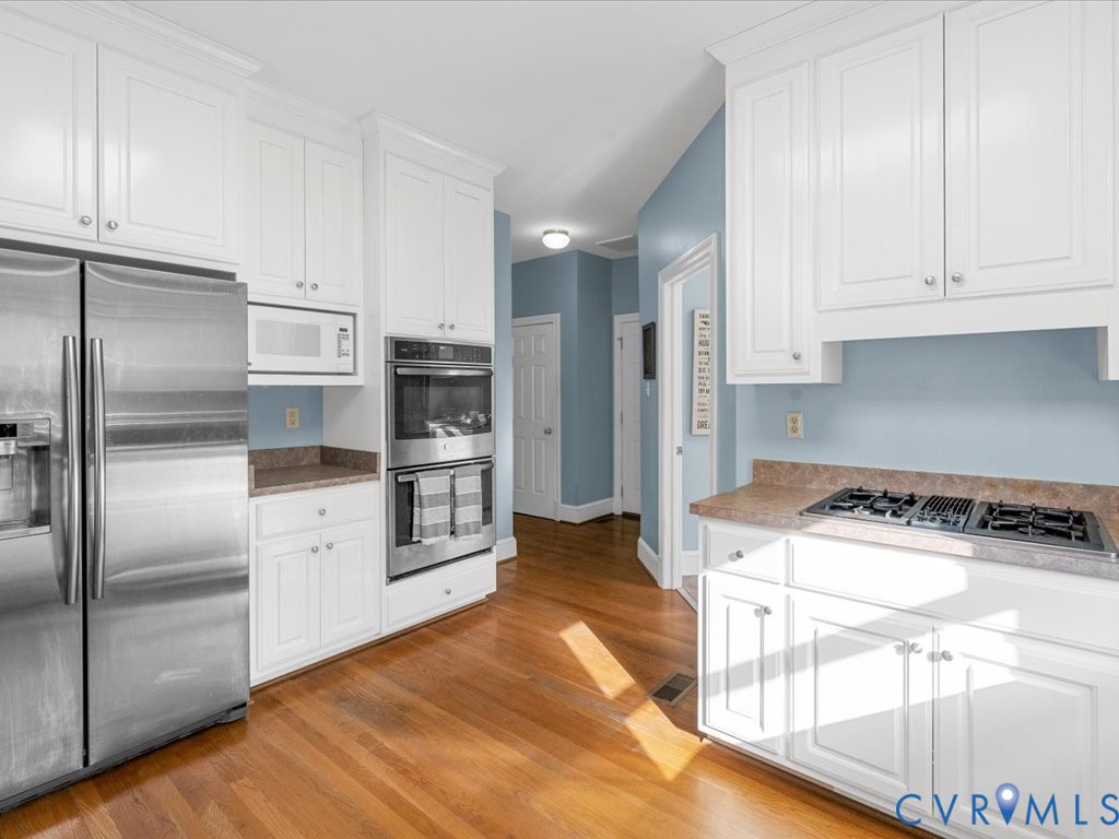 5515 Herring Creek Road Aylett, VA 23009 - Photo 25 of 50 a kitchen with stainless steel appliances granite countertop a refrigerator a stove and a sink