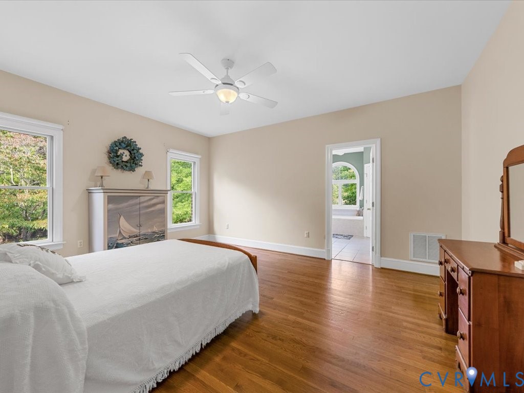 5515 Herring Creek Road Aylett, VA 23009 - Photo 29 of 50 a bedroom with a bed and a flat screen tv