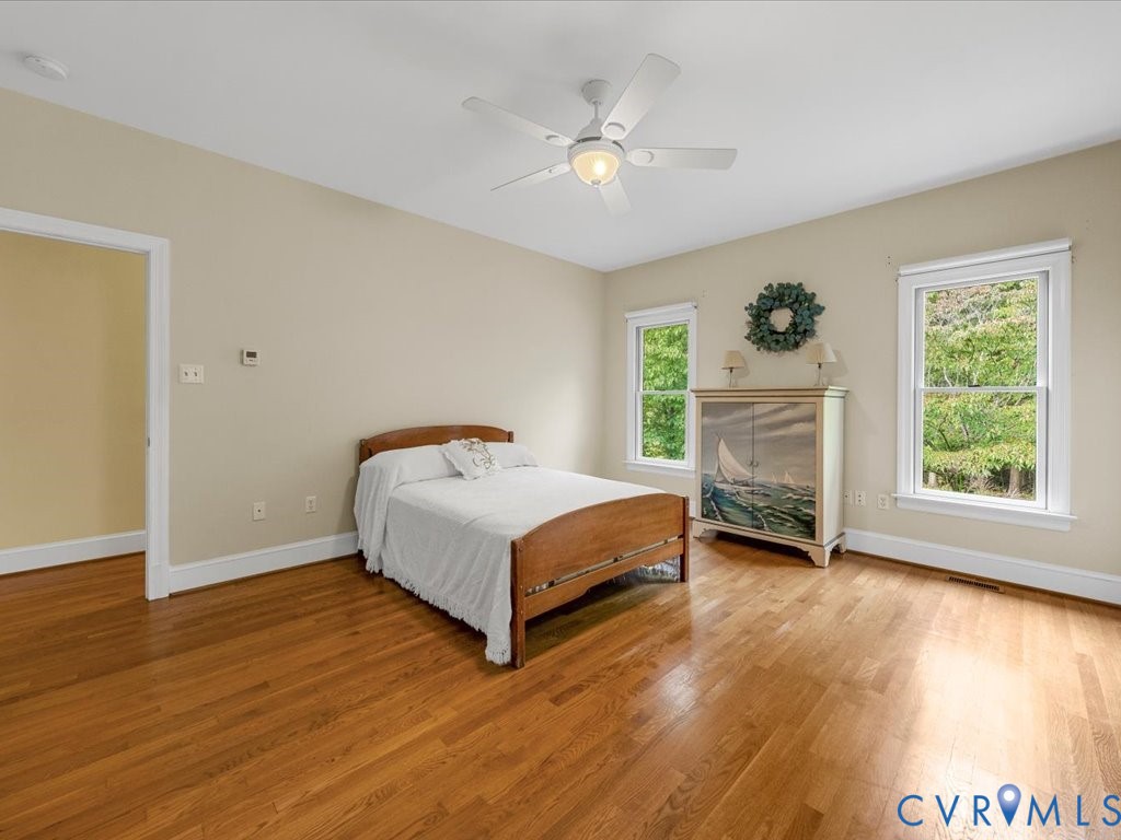5515 Herring Creek Road Aylett, VA 23009 - Photo 30 of 50 a spacious bedroom with a bed and a window