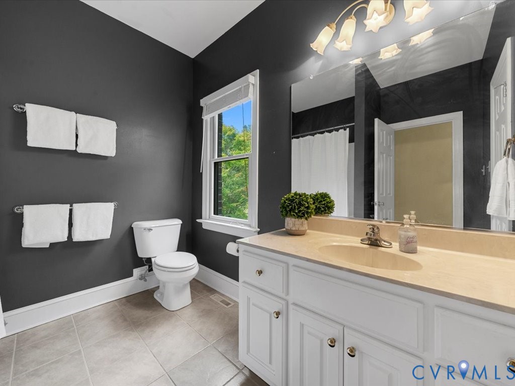 5515 Herring Creek Road Aylett, VA 23009 - Photo 37 of 50 a bathroom with a sink toilet and a mirror