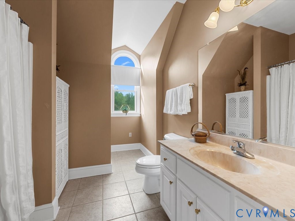 5515 Herring Creek Road Aylett, VA 23009 - Photo 38 of 50 a bathroom with a double vanity sink mirror and toilet