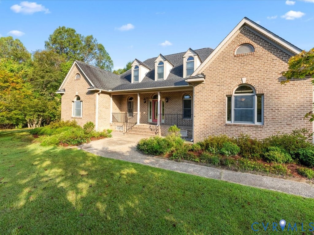 5515 Herring Creek Road Aylett, VA 23009 - Photo 7 of 50 a front view of a house with garden