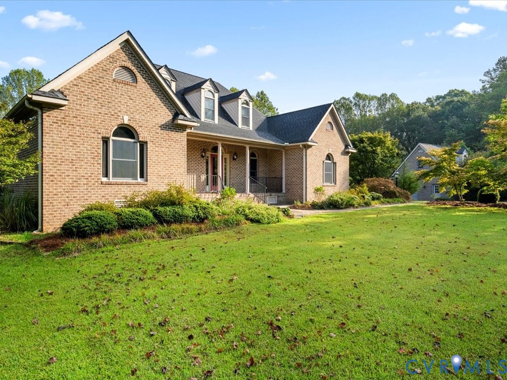 5515 Herring Creek Road Aylett, VA 23009 - Photo 10 of 50 a front view of a house with a yard and trees