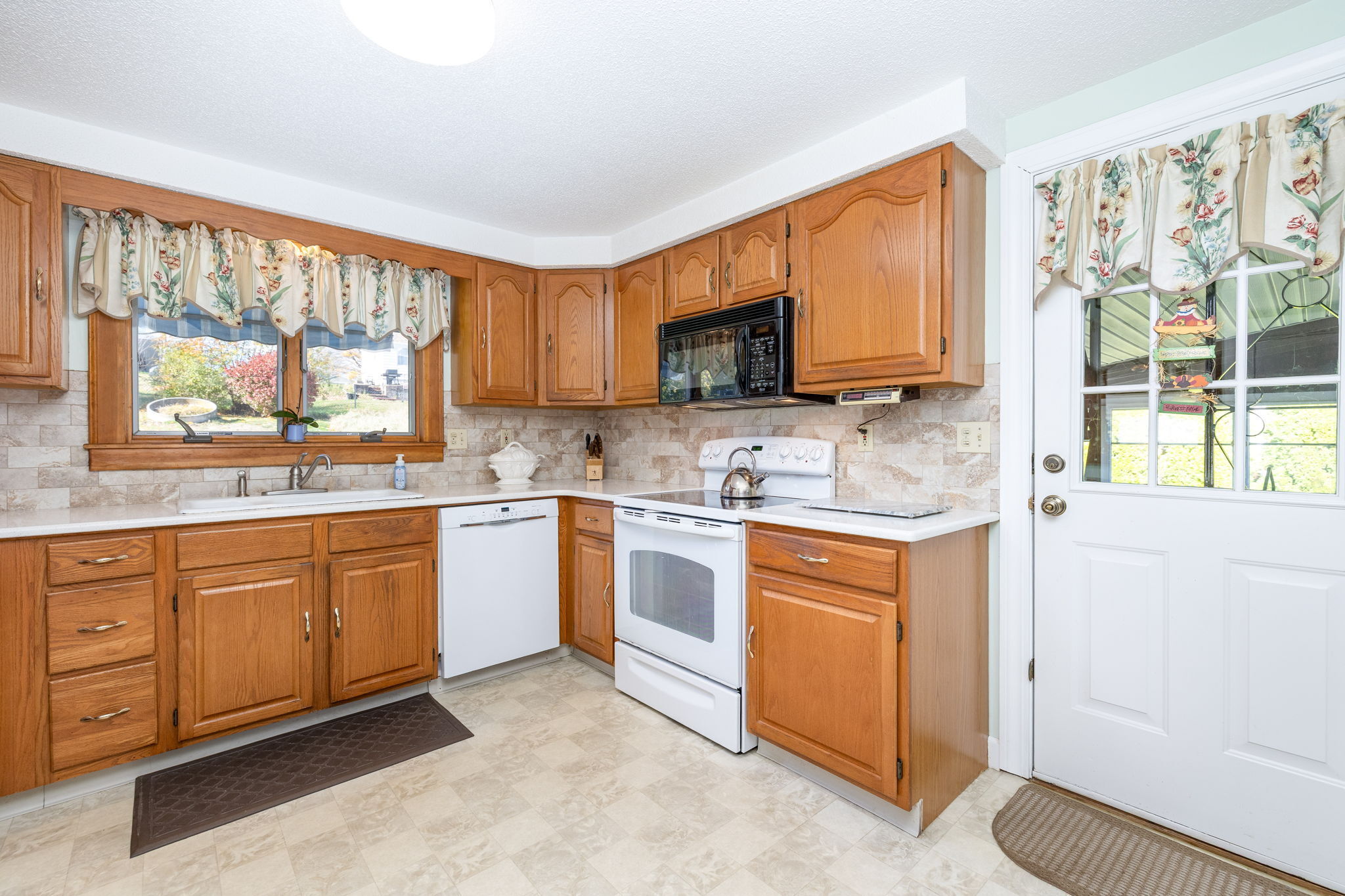 231 Charter Road Rocky Hill, CT 06067 - Photo 15 of 37 a kitchen with stainless steel appliances granite countertop a stove a sink and a microwave