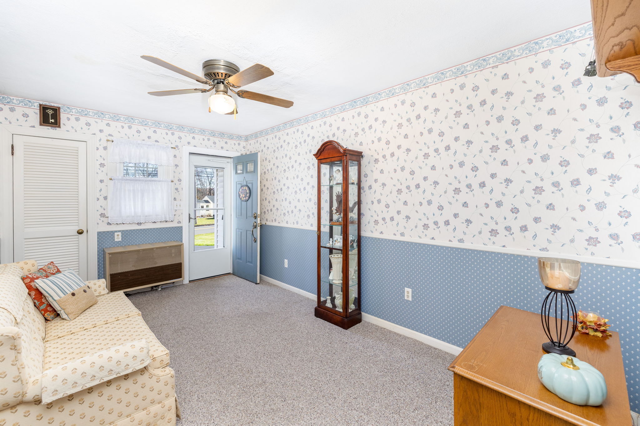231 Charter Road Rocky Hill, CT 06067 - Photo 17 of 37 a living room with furniture and a chandelier
