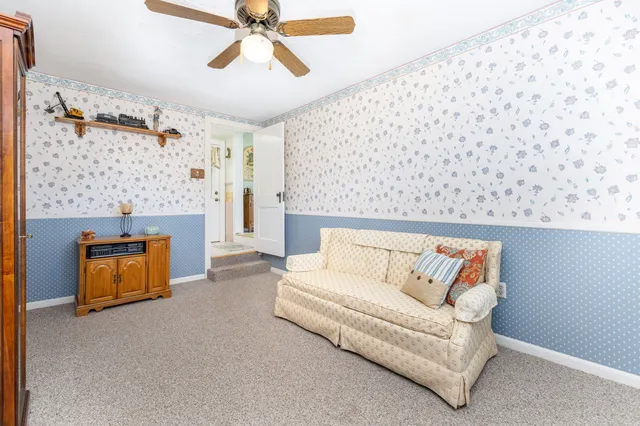a bathroom with a sink mirror and toilet