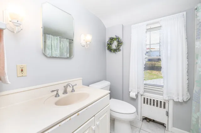 a bathroom with a sink and mirror