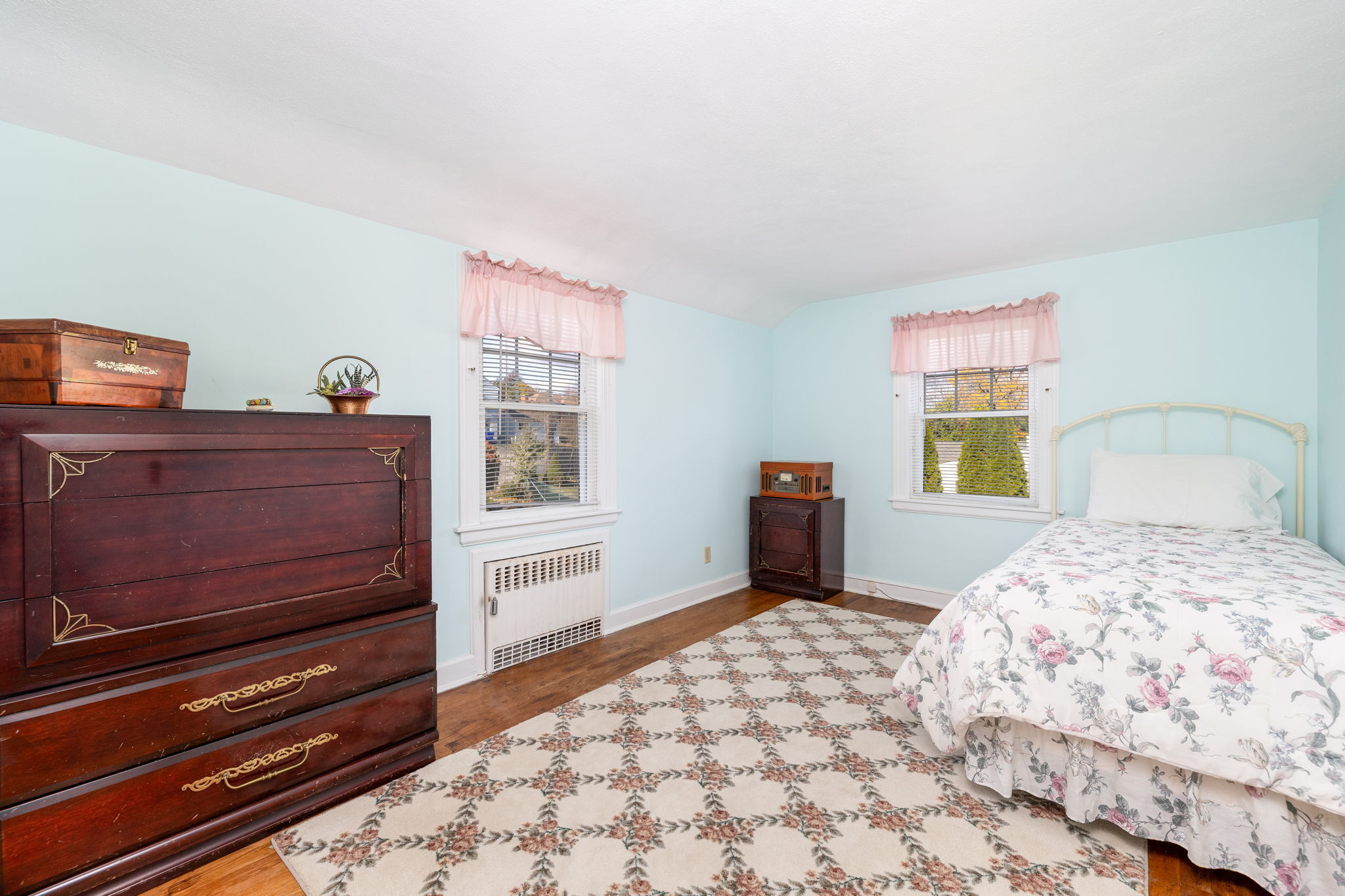231 Charter Road Rocky Hill, CT 06067 - Photo 28 of 37 a bedroom with a bed and wooden floor