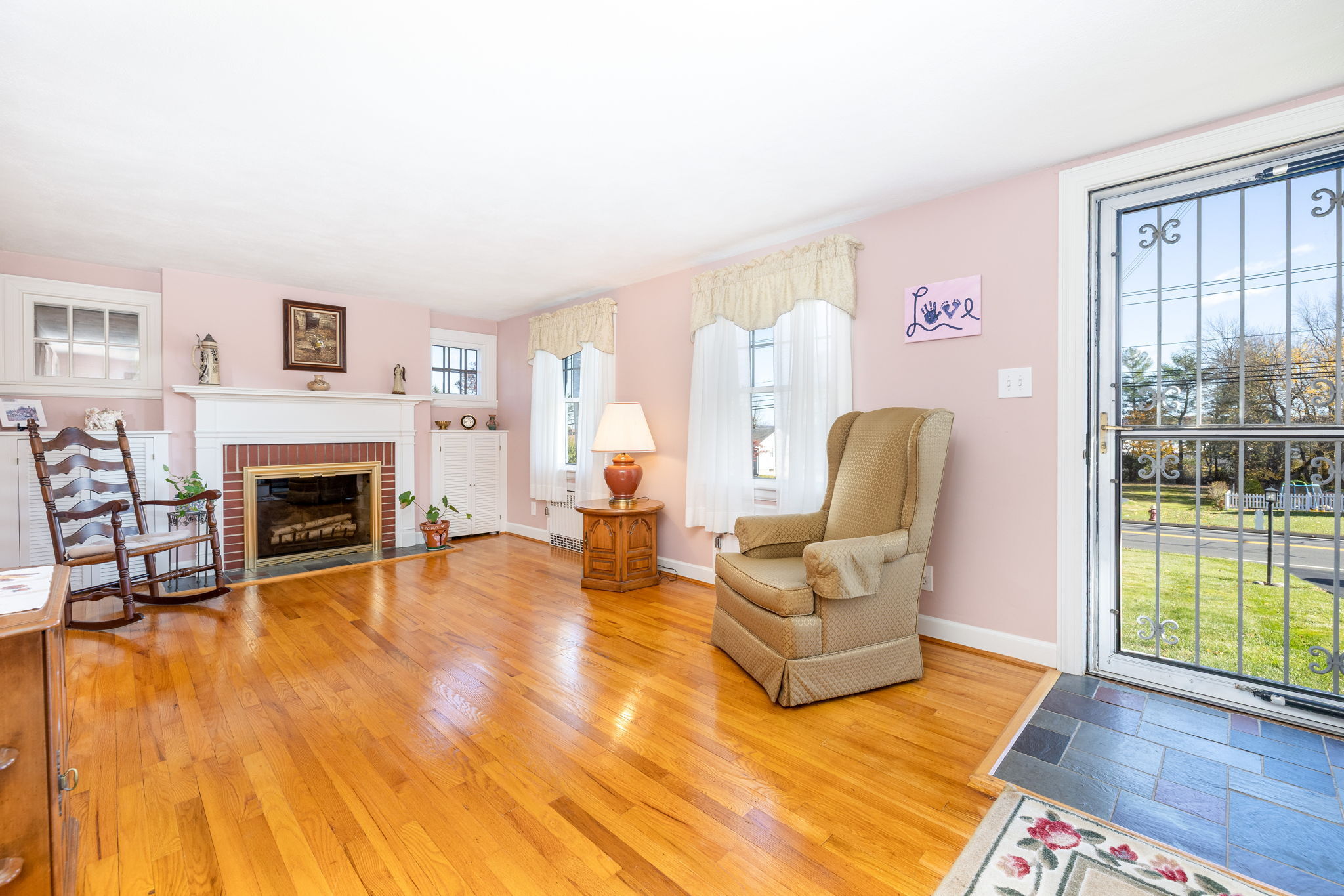 231 Charter Road Rocky Hill, CT 06067 - Photo 7 of 37 a living room with furniture and a fireplace