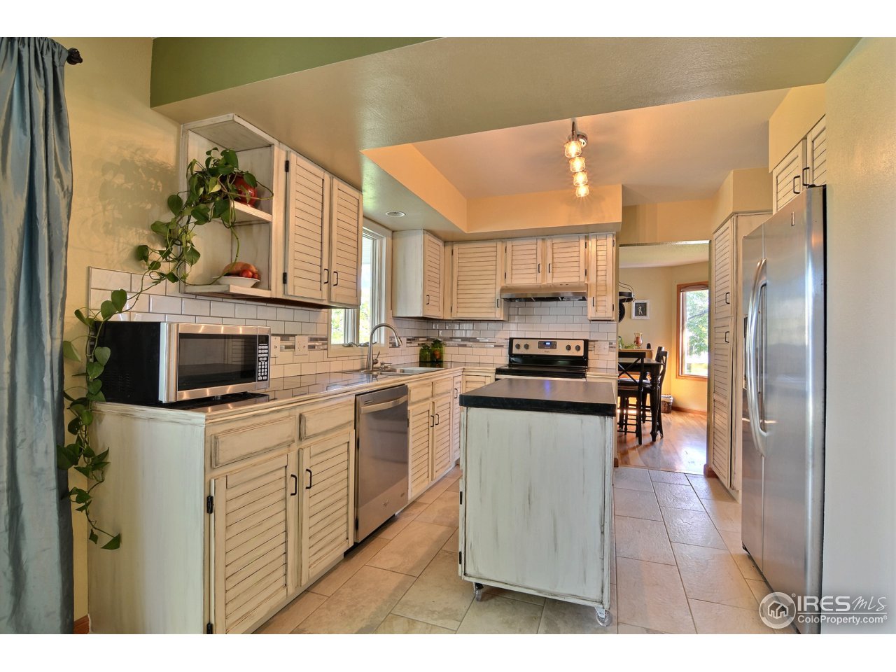 4371 West 16th Street Road Greeley, CO 80634 - Photo 8 of 23 Kitchen w/Mobile Island
