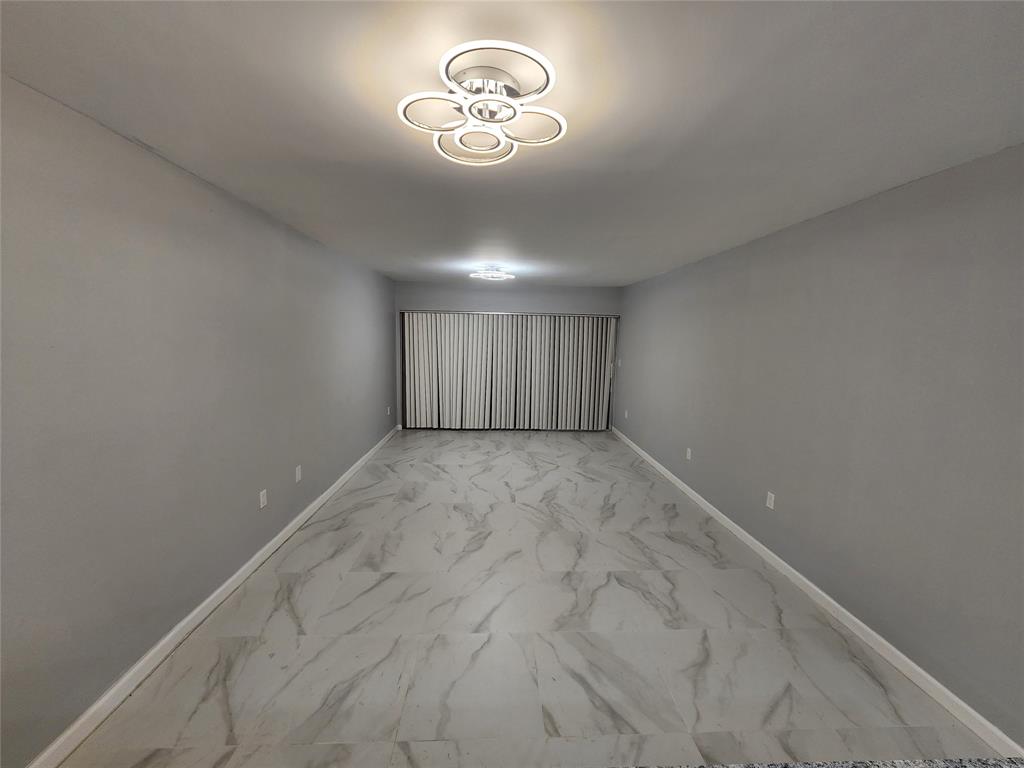 485 North Pine Island Road, Unit 204 Fort Lauderdale, FL 33324 - Photo 5 of 14 a view of an empty room with a window