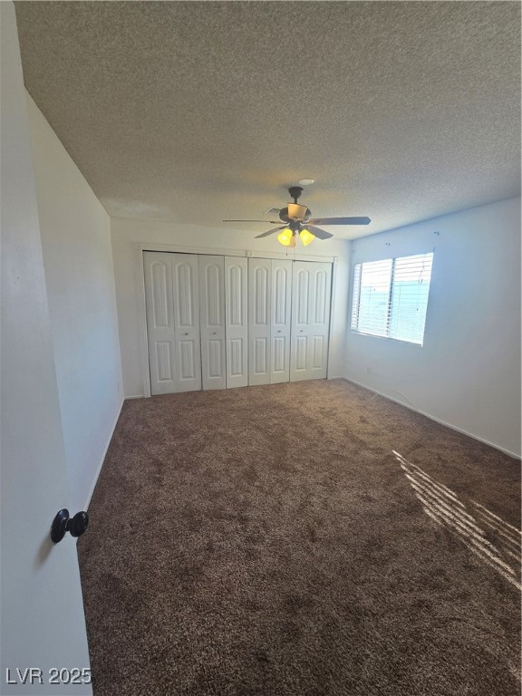 2232 Aspen Mirror Way, Unit 204 Laughlin, NV 89029 - Photo 16 of 37 Unfurnished bedroom featuring carpet floors, a textured ceiling, and a ceiling fan