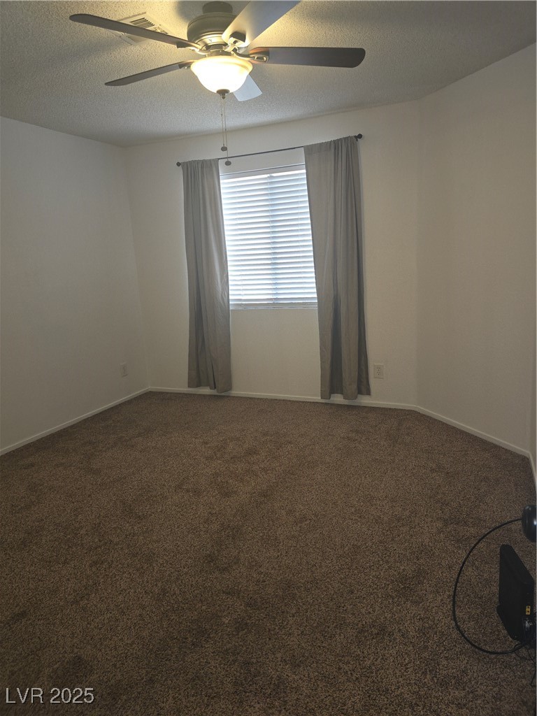 2232 Aspen Mirror Way, Unit 204 Laughlin, NV 89029 - Photo 22 of 37 Empty room with a ceiling fan, carpet floors, a textured ceiling, and baseboards