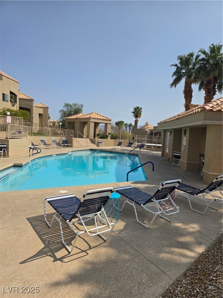 2232 Aspen Mirror Way, Unit 204 Laughlin, NV 89029 - Photo 29 of 37 Pool with a gazebo, fence, and a patio