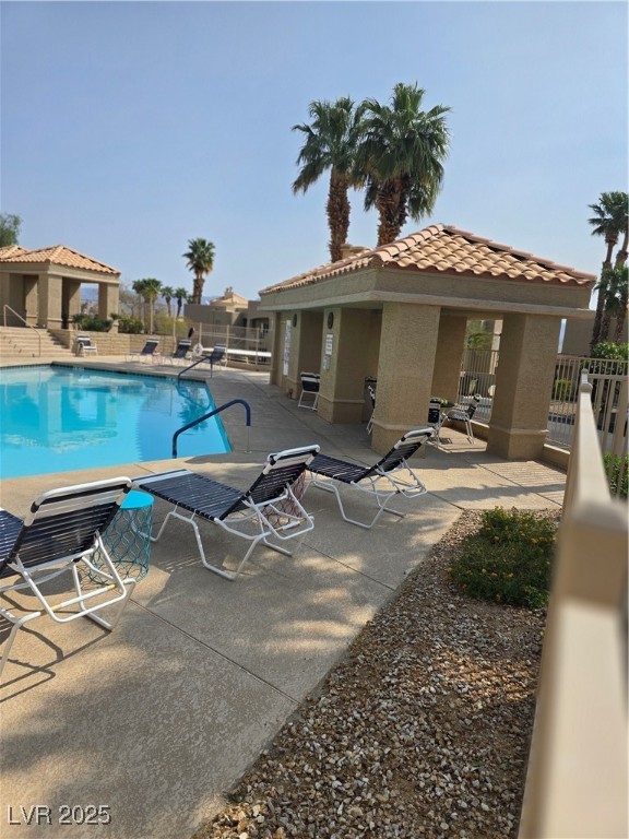 2232 Aspen Mirror Way, Unit 204 Laughlin, NV 89029 - Photo 30 of 37 Community pool featuring a patio and fence