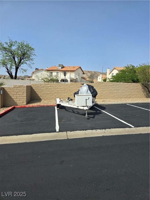 2232 Aspen Mirror Way, Unit 204 Laughlin, NV 89029 - Photo 33 of 37 Uncovered parking lot with a fenced backyard