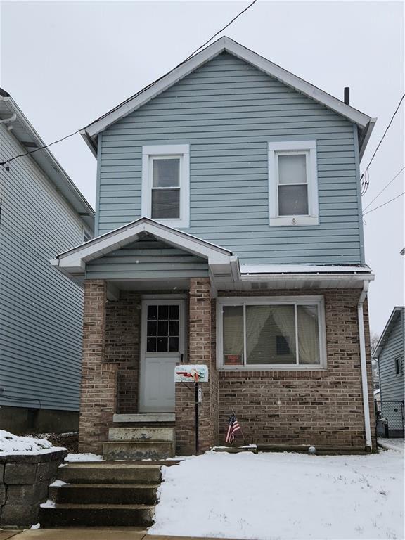 a front view of a house with stairs