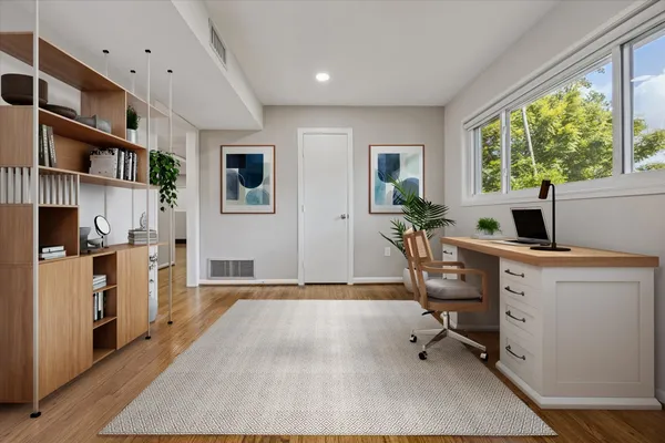 a workspace with furniture and a window