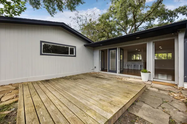 a view of house with backyard