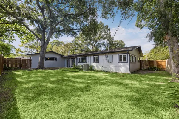 a house with trees in the background