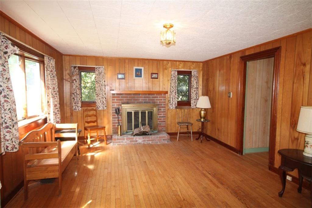 350 Ocean Point Road East Boothbay, ME 04544 - Photo 5 of 22 The living room with fireplace and...