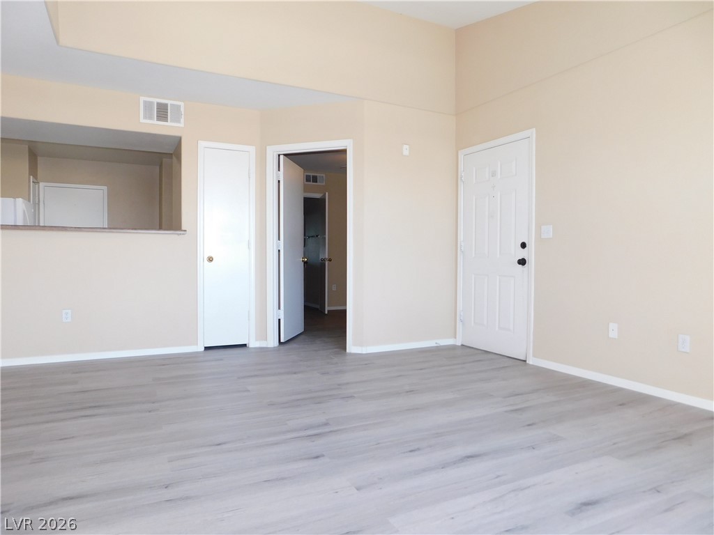 7255 West Sunset Road, Unit 2029 Las Vegas, NV 89113 - Photo 3 of 21 An inviting entry and open living area feature light-toned flooring and fresh wall paint.