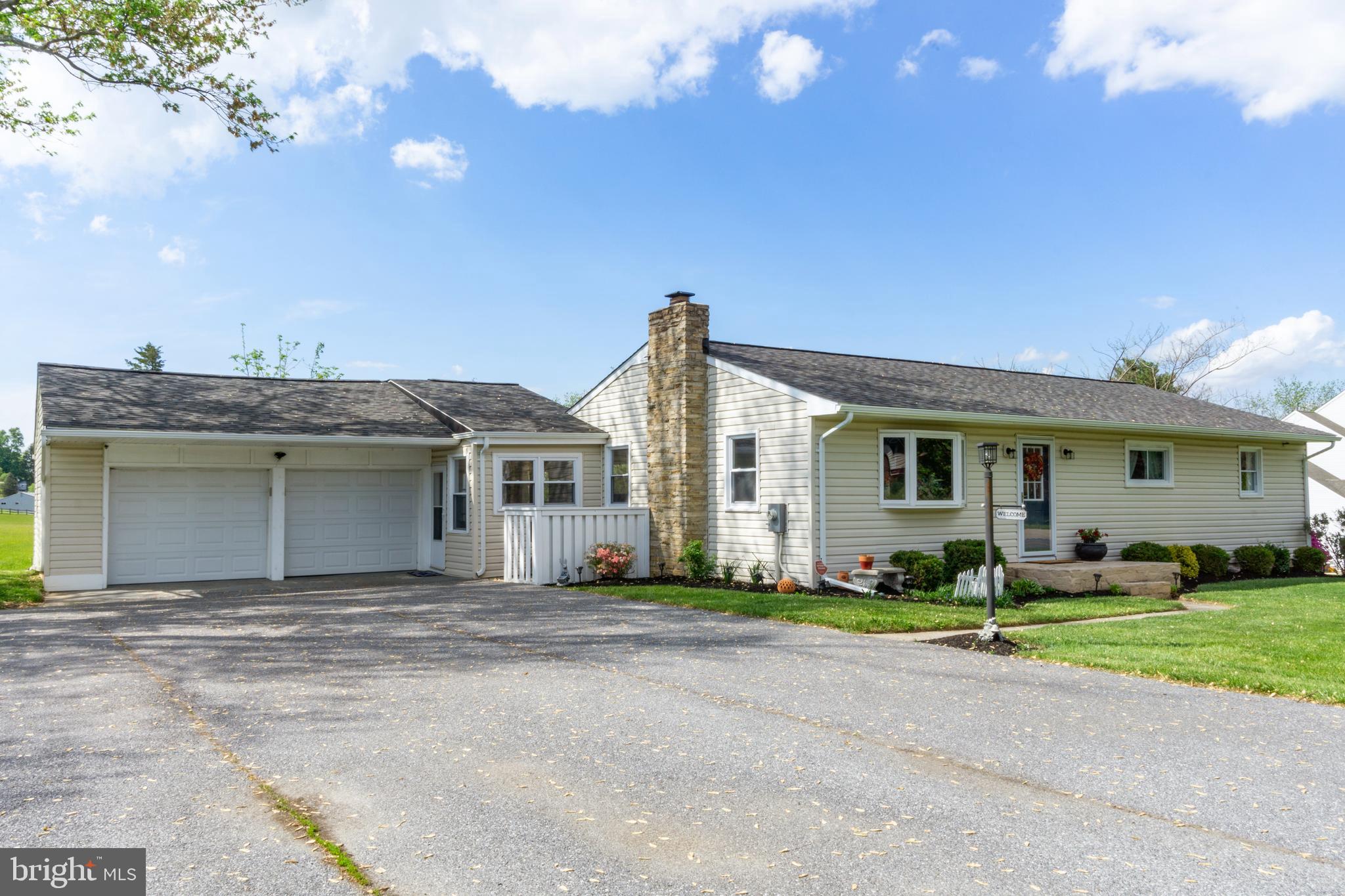 1556 Fairmount Road Hampstead, MD 21074 - Photo 1 of 48 a front view of a house with a yard and garage