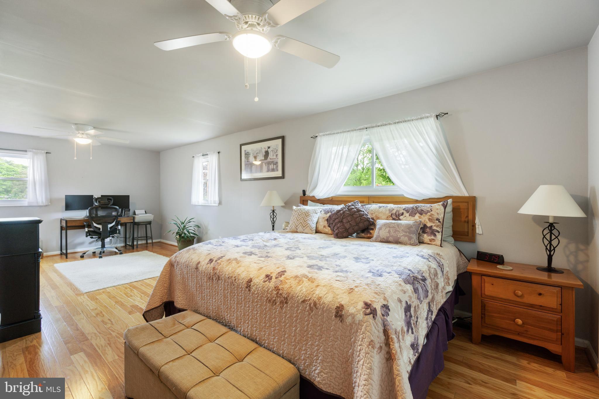 1556 Fairmount Road Hampstead, MD 21074 - Photo 16 of 48 a bedroom with a bed and a chandelier