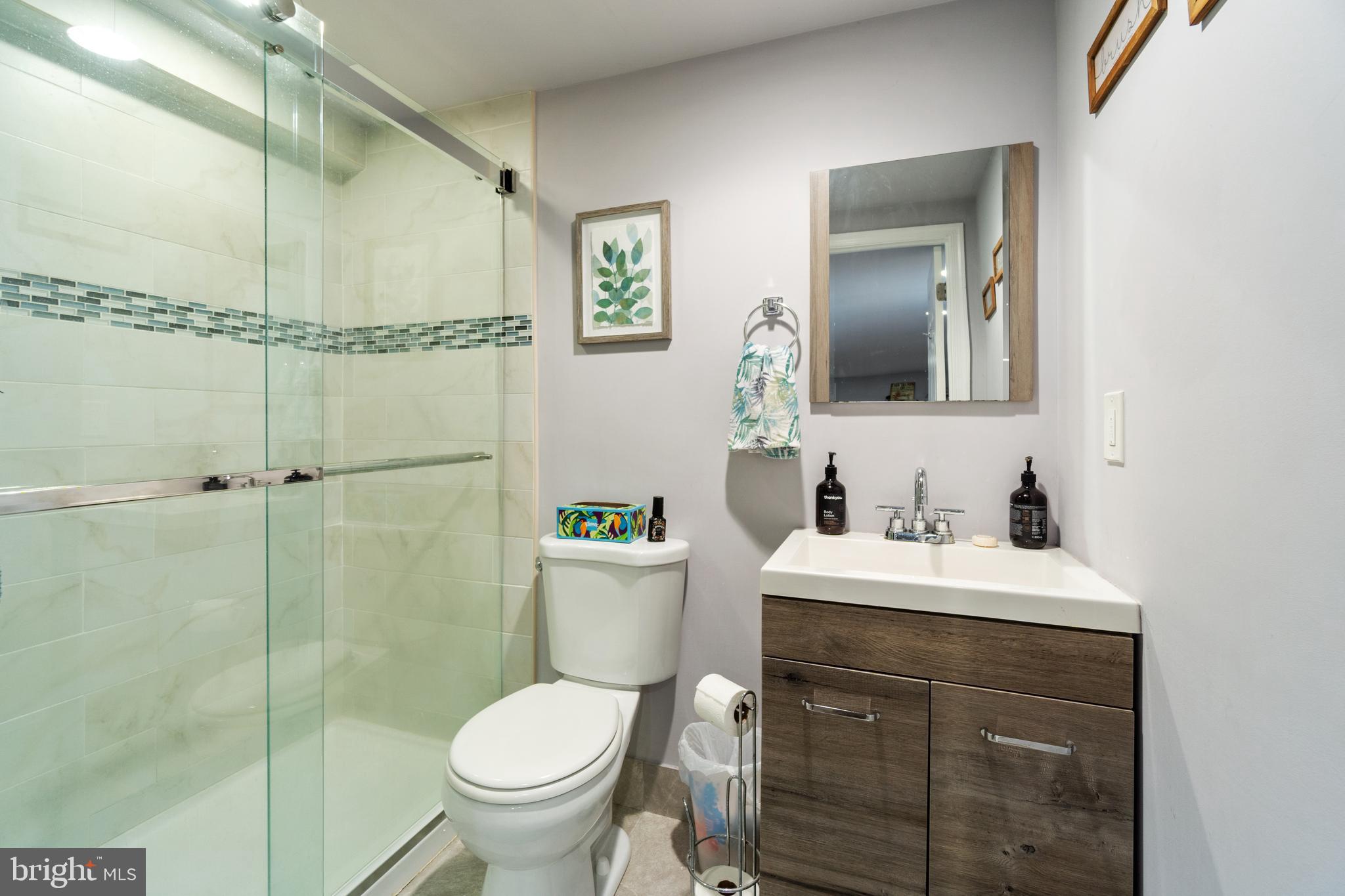 1556 Fairmount Road Hampstead, MD 21074 - Photo 31 of 48 a bathroom with a sink toilet vanity and shower