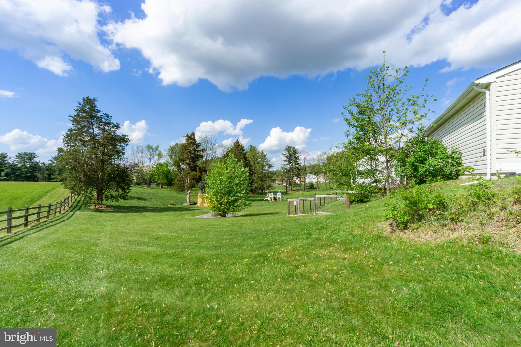 1556 Fairmount Road Hampstead, MD 21074 - Photo 36 of 48 a view of a golf course with a lake