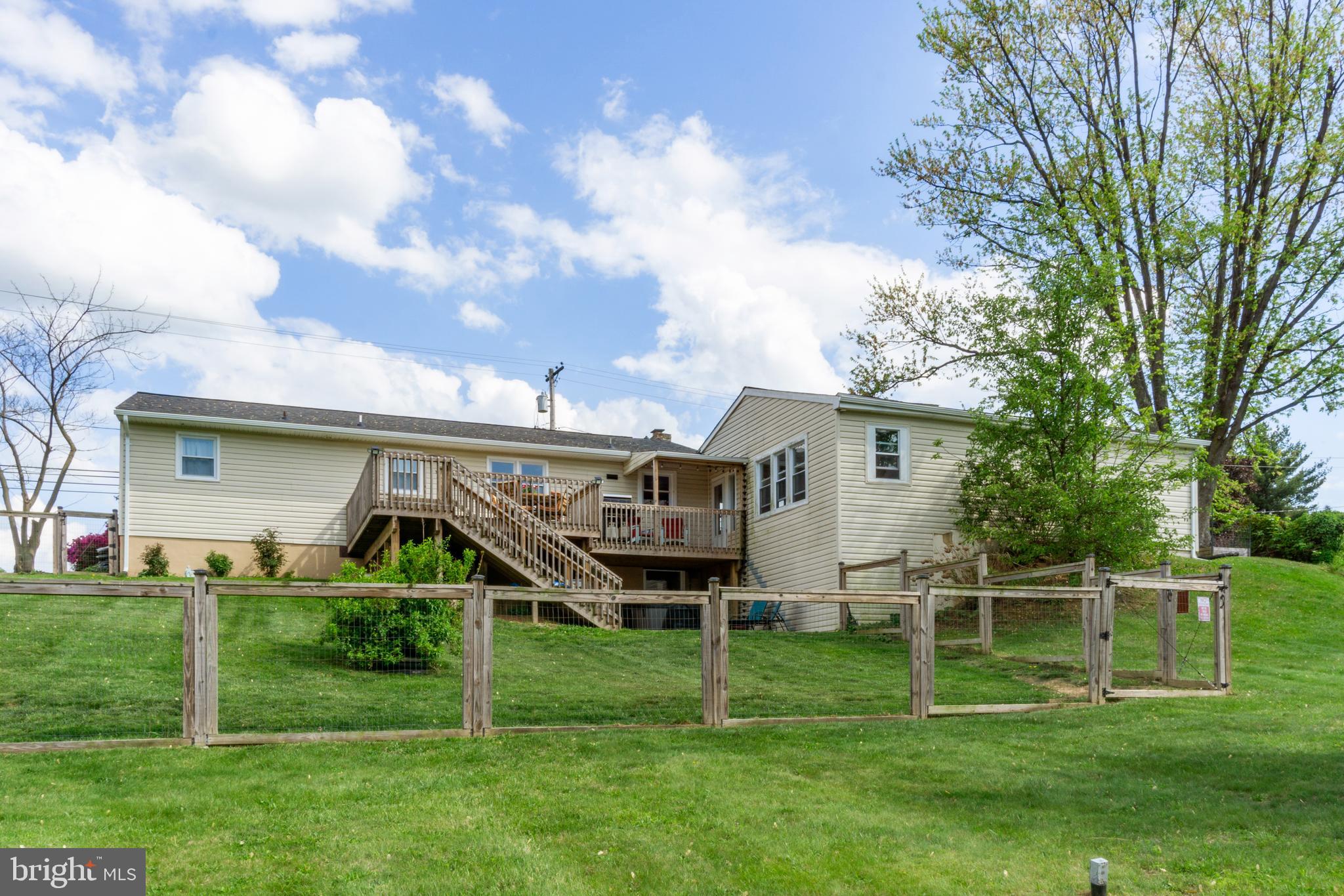 1556 Fairmount Road Hampstead, MD 21074 - Photo 40 of 48 a front view of a house with a yard and green space