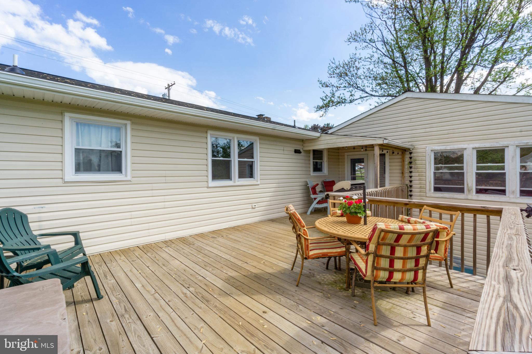 1556 Fairmount Road Hampstead, MD 21074 - Photo 44 of 48 a backyard of a house with wooden floor table and chairs