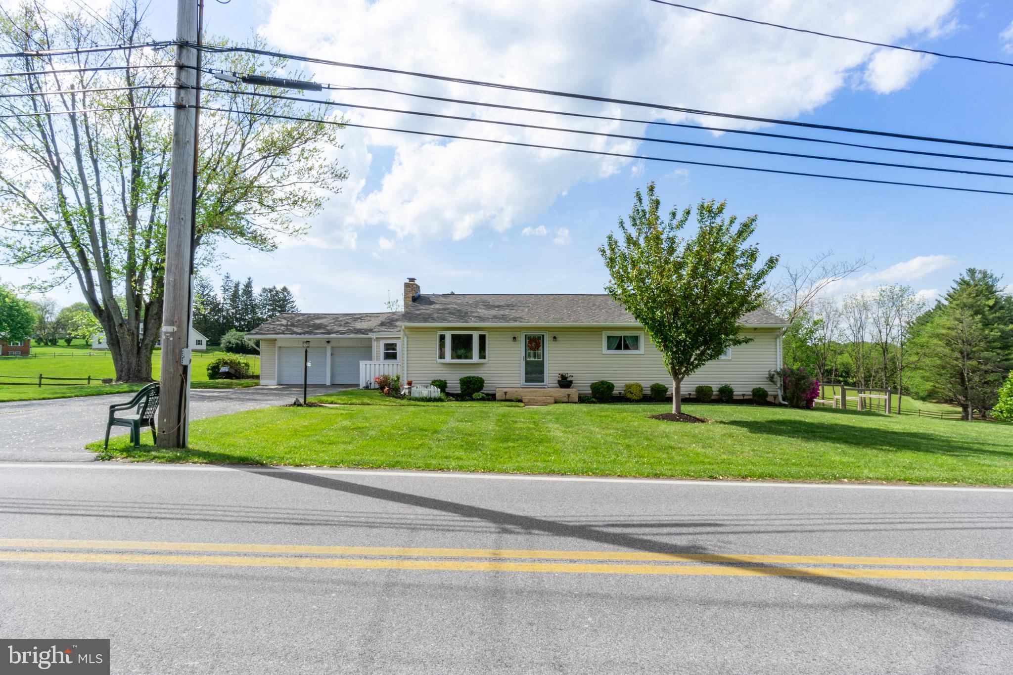 1556 Fairmount Road Hampstead, MD 21074 - Photo 48 of 48 a front view of a house with a yard and a garage