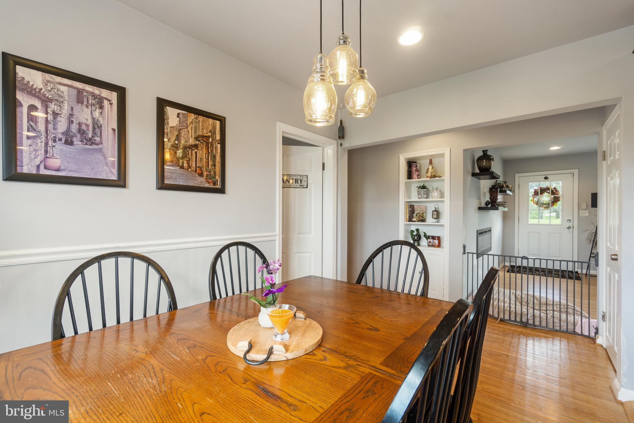1556 Fairmount Road Hampstead, MD 21074 - Photo 6 of 48 a view of a dining room with furniture and wooden floor
