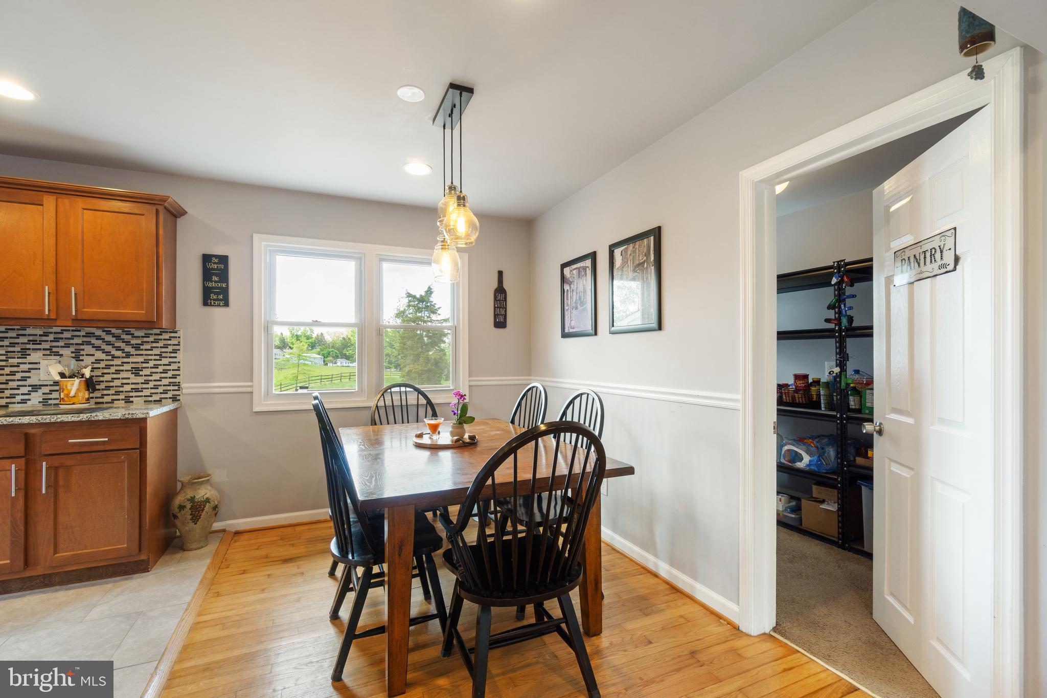1556 Fairmount Road Hampstead, MD 21074 - Photo 7 of 48 a view of a dining room with furniture window and wooden floor