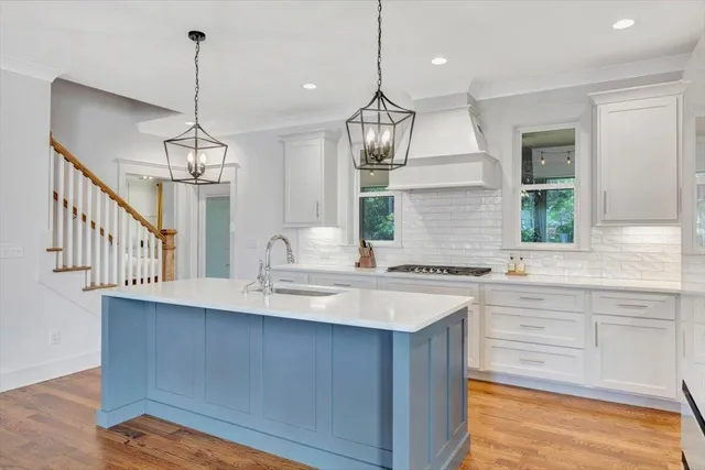 a kitchen with sink cabinets and window