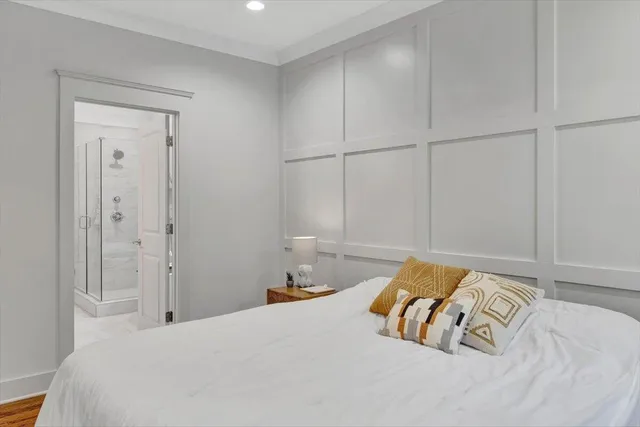 a bedroom with a bed and cabinets