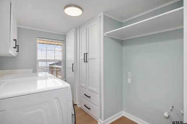 a spacious bathroom with a bathtub sink and mirror
