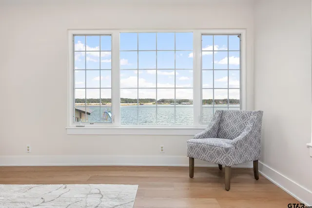 a spacious bedroom with a bed and a window