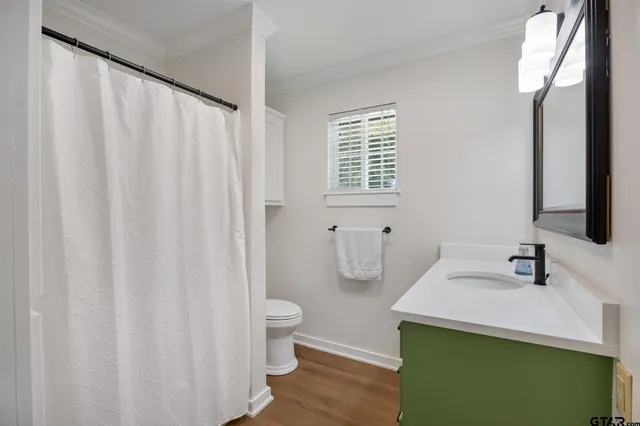 a bathroom with a sink vanity and a mirror