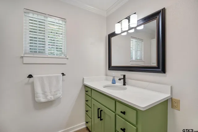 a view of a workspace with furniture and wooden floor
