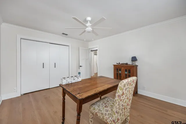 a view of a deck with wooden floor and outdoor seating