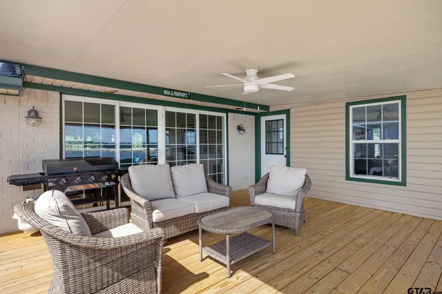 a view of a balcony with floor to ceiling windows