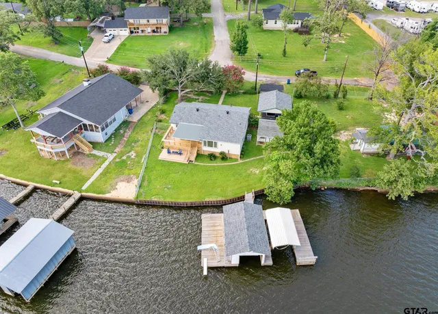an aerial view of a swimming pool and mountain view