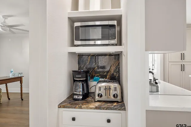 a kitchen with a stove and a microwave