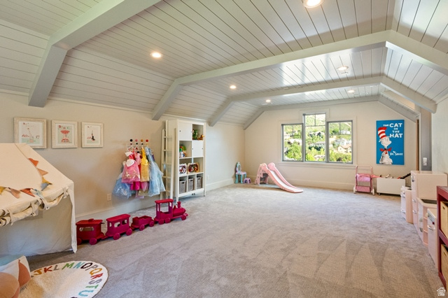 3 Carriagewood Cove, Unit 1088 Sandy, UT 84092 - Photo 45 of 79 Spacious room featuring vaulted ceilings with exposed beams and shiplap-style paneling, recessed lighting, and light-colored carpeting